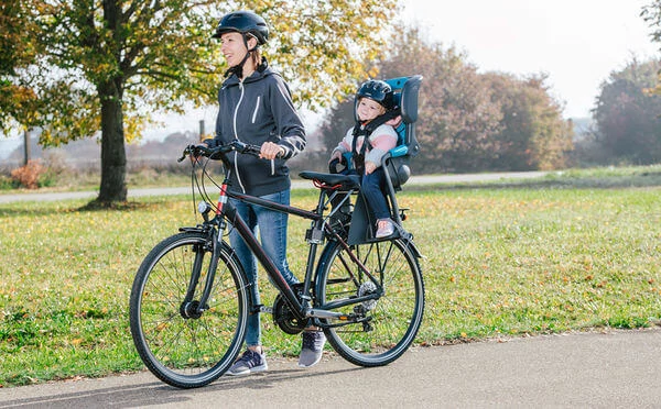 parent cycling an infant