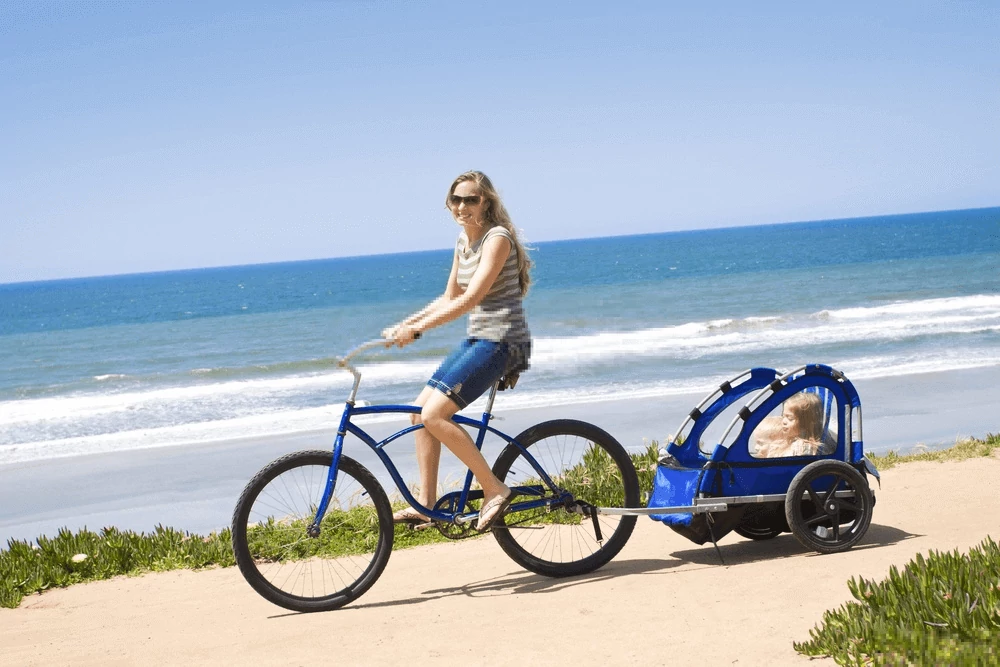 Kids on a bike trailer during summer