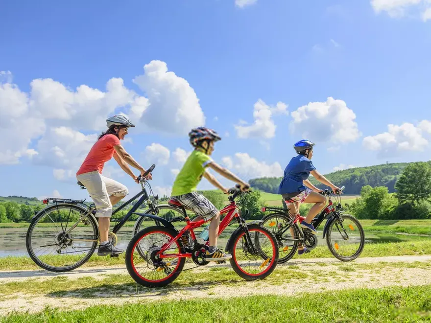 Family cycling together